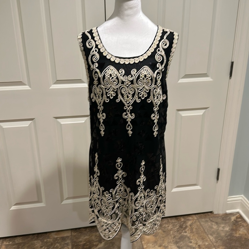 Sheer sheath dress with sequins appliqué.
